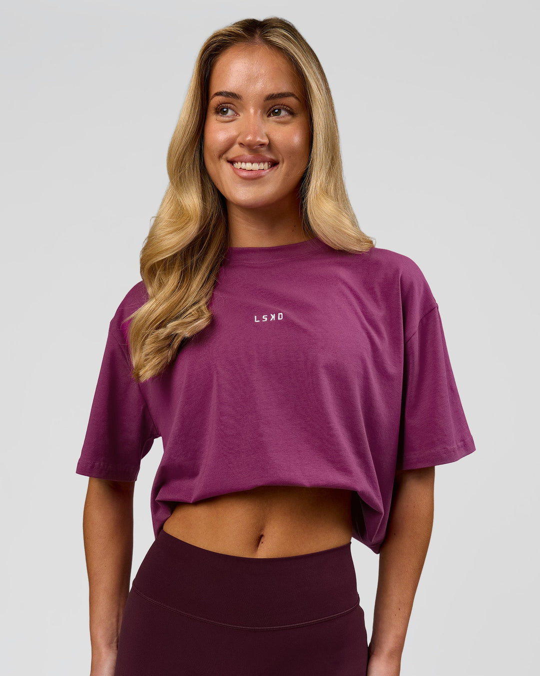 Woman wearing Go-To FLXCotton Oversized Tee - Boysenberry-White | Model:Issy | Size:XS - view 7