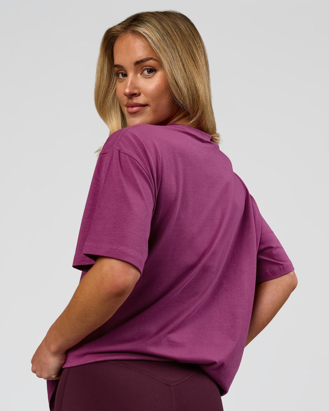Woman wearing Go-To FLXCotton Oversized Tee - Boysenberry-White | Model:Issy | Size:XS - view 8