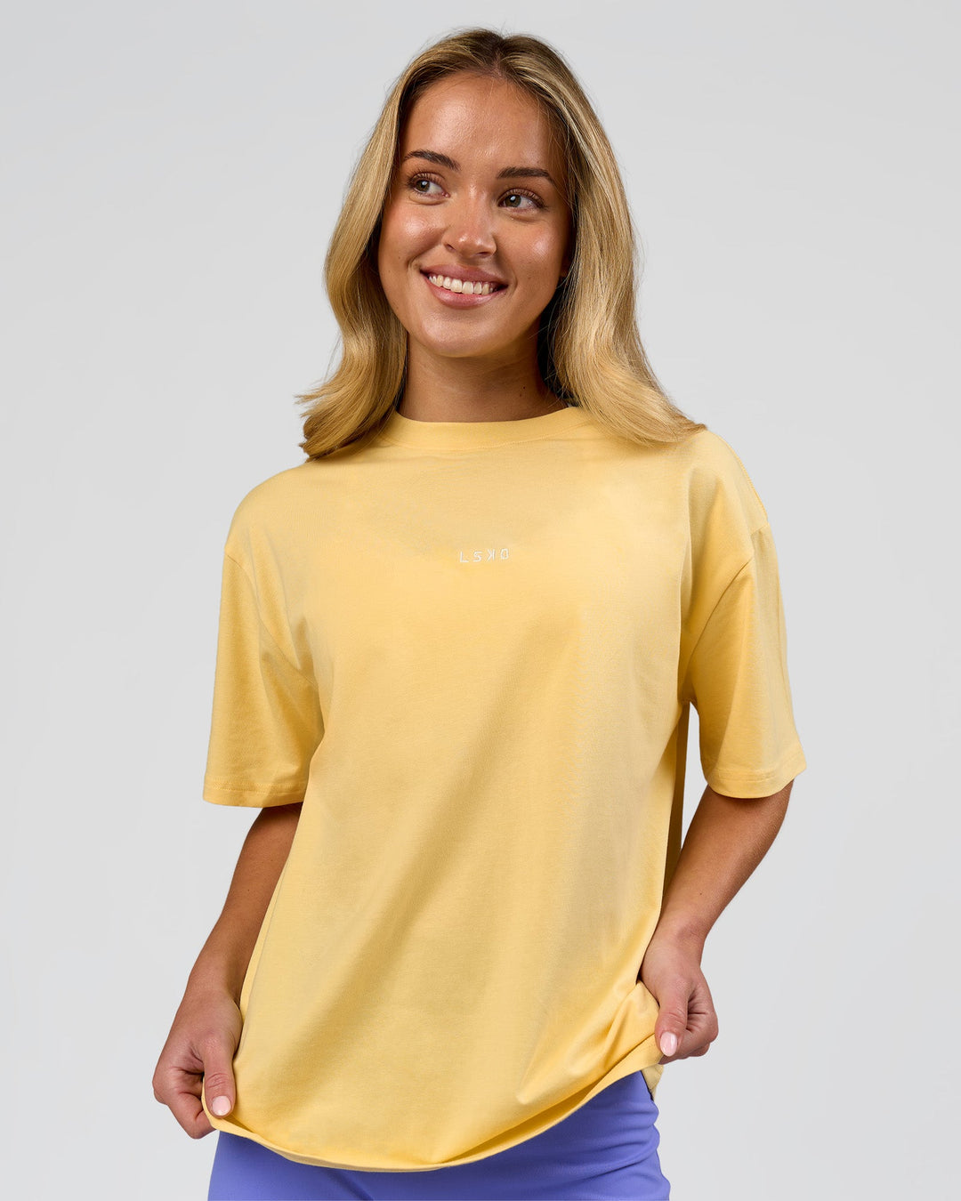 Woman wearing Go-To FLXCotton Oversized Tee - Lemon-White | Model:Issy | Size:XS - view 1