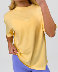 Woman wearing Go-To FLXCotton Oversized Tee - Lemon-White | Model:Issy | Size:XS | Thumbnail Index: 5
