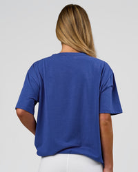 Woman wearing Go-To FLXCotton Oversized Tee - Power Cobalt-White | Model:Issy | Size:XS | Thumbnail Index: 7