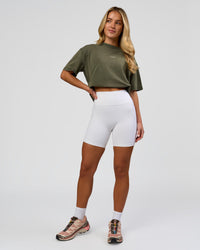 Woman wearing Go-To FLXCotton Oversized Tee - Pure Olive Washed | Model:Issy | Size:XS | Thumbnail Index: 5