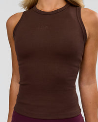 Woman wearing Go-To FLXCotton Rib High Neck Tank - Hot Chocolate | Model:Issy | Size:XS | Thumbnail Index: 1