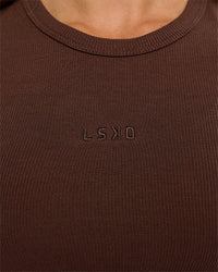 Woman wearing Go-To FLXCotton Rib High Neck Tank - Hot Chocolate | Model:Issy | Size:XS | Thumbnail Index: 2