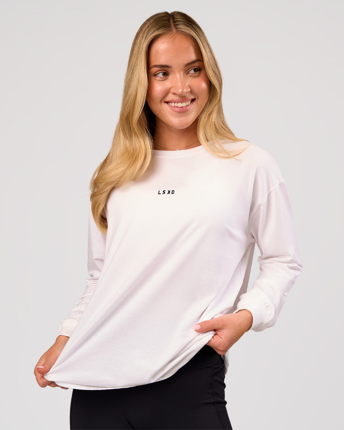 Woman wearing Go-To Long Sleeve FLXCotton Oversized Tee - White-Black | Model:Issy | Size:XS