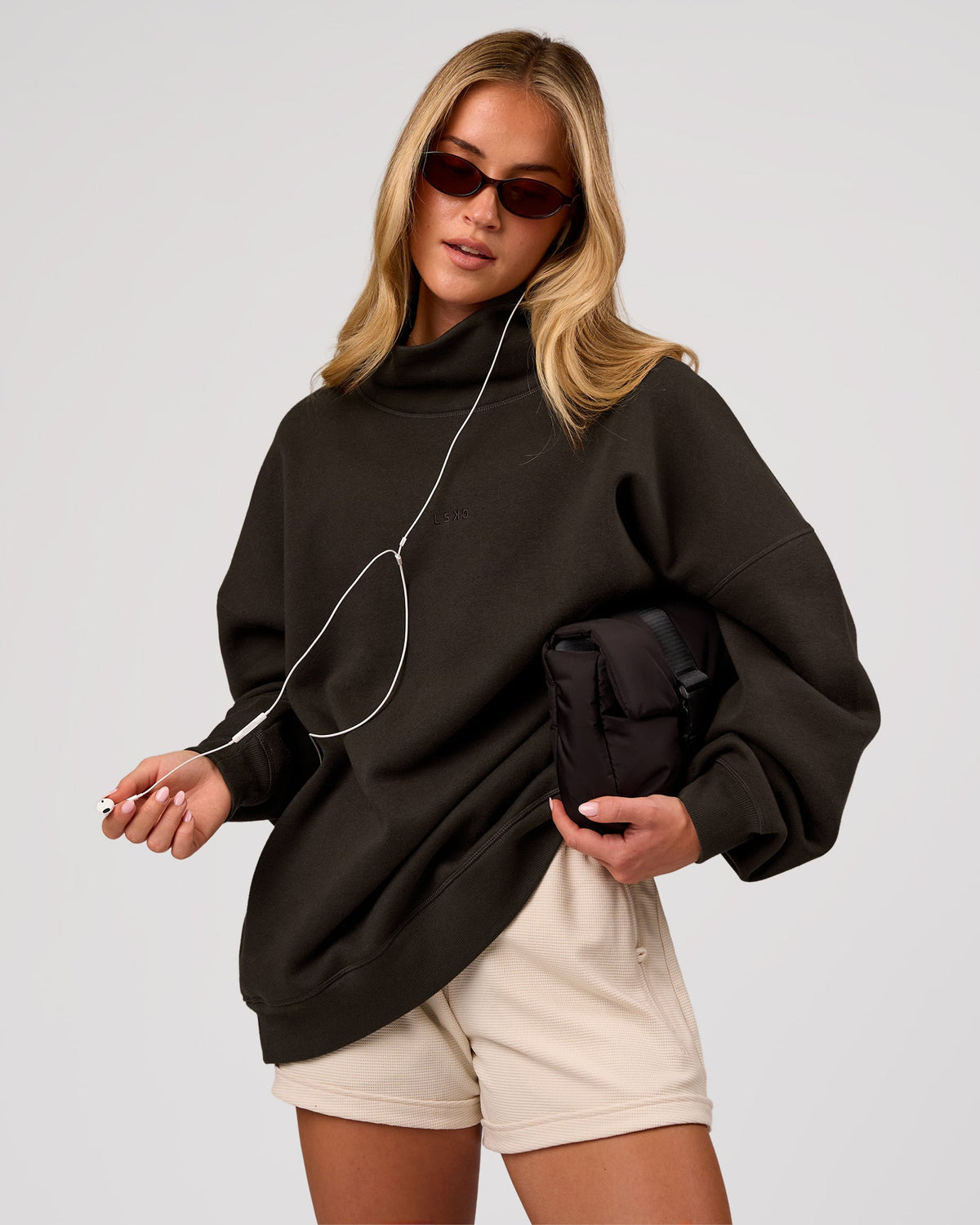 Woman wearing Go-To Oversized Mock Neck Sweater - Ground Coffee | Model:Issy | Size:XS
