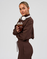 Woman wearing Go-To Oversized Quarter Zip Sweater - Hot Chocolate | Model:Issy | Size:XS