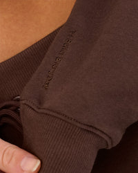 Woman wearing Go-To Oversized Quarter Zip Sweater - Hot Chocolate | Model:Issy | Size:XS