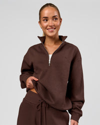 Woman wearing Go-To Oversized Quarter Zip Sweater - Hot Chocolate | Model:Issy | Size:XS