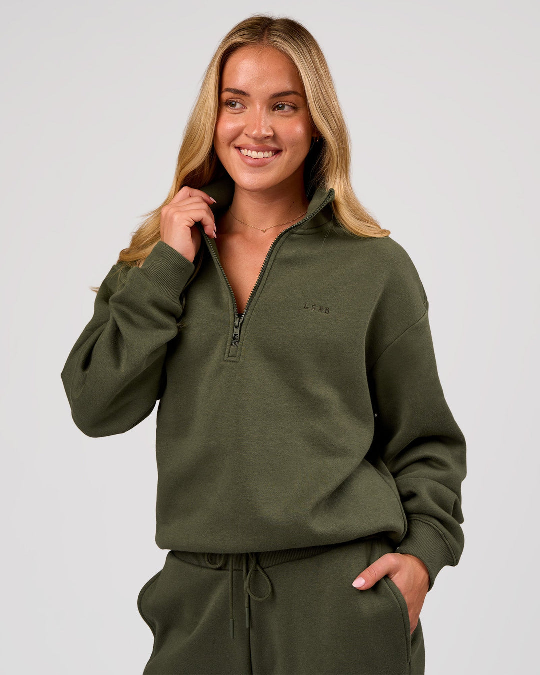 Woman wearing Go-To Oversized Quarter Zip Sweater - Pure Olive | Model:Issy | Size:XS - view 1