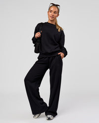 Woman wearing Go-To Oversized Sweater - Black | Model:Issy | Size:XS | Thumbnail Index: 3
