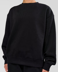 Woman wearing Go-To Oversized Sweater - Black | Model:Issy | Size:XS | Thumbnail Index: 4