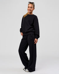 Woman wearing Go-To Oversized Sweater - Black | Model:Issy | Size:XS | Thumbnail Index: 5