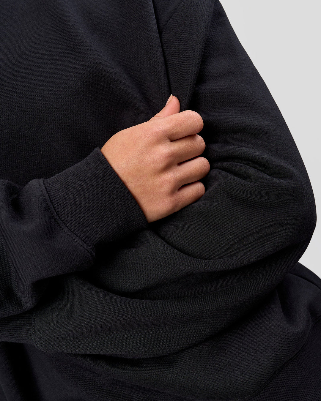 Woman wearing Go-To Oversized Sweater - Black | Model:Issy | Size:XS
