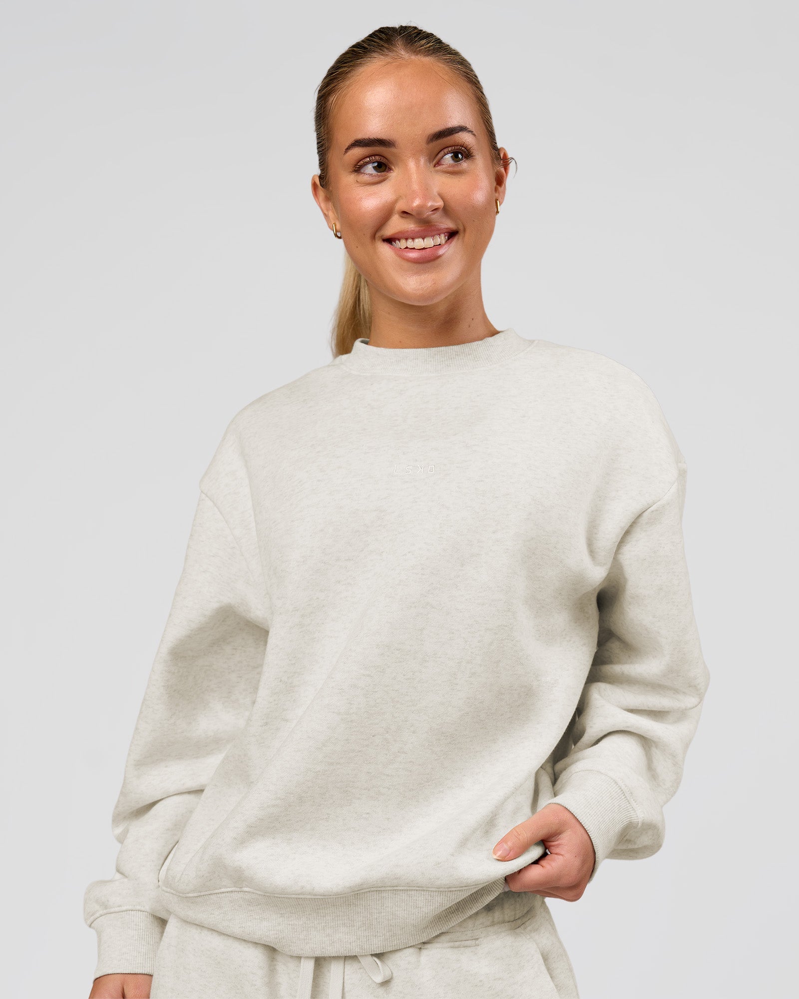 Woman wearing Go-To Oversized Sweater - Silver Marl | Model:Issy | Size:XS