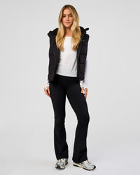 Woman wearing Go-To Puffer Vest - Black | Model:Issy | Size:XS