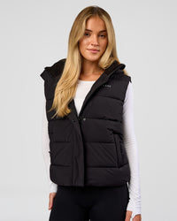 Woman wearing Go-To Puffer Vest - Black | Model:Issy | Size:XS