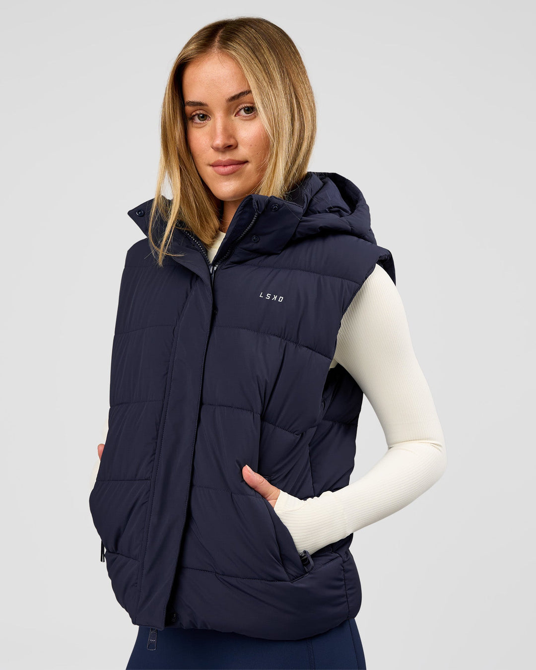 Woman wearing Go-To Puffer Vest - Future Navy | Model:Issy | Size:XS