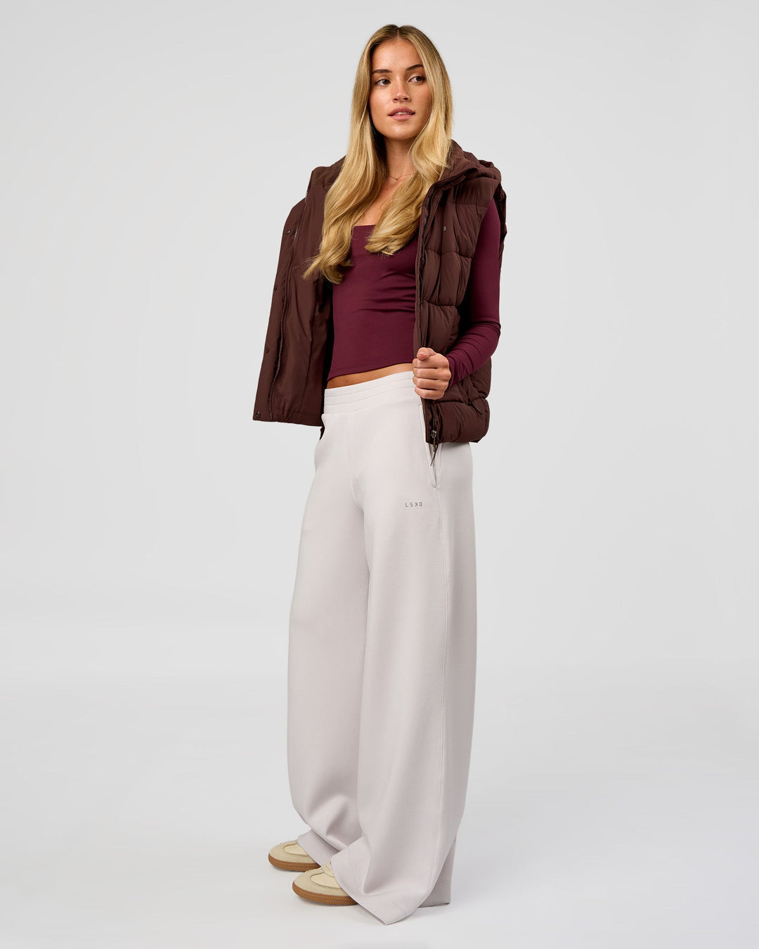 Woman wearing Go-To Puffer Vest - Hot Chocolate | Model:Issy | Size:XS