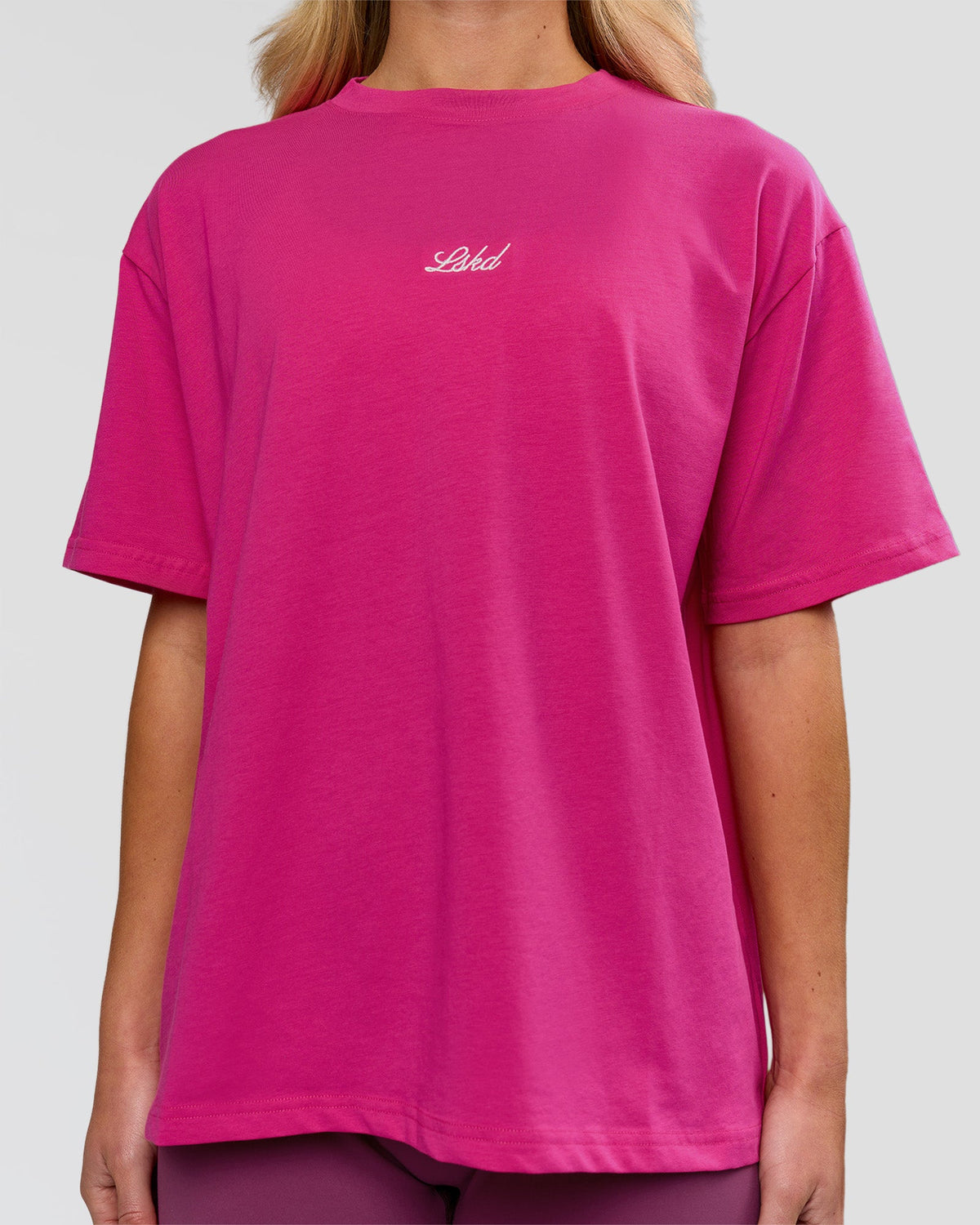 Woman wearing Go-To Script FLXCotton Oversized Tee - Ultra Pink-White | Model:Issy | Size:XS