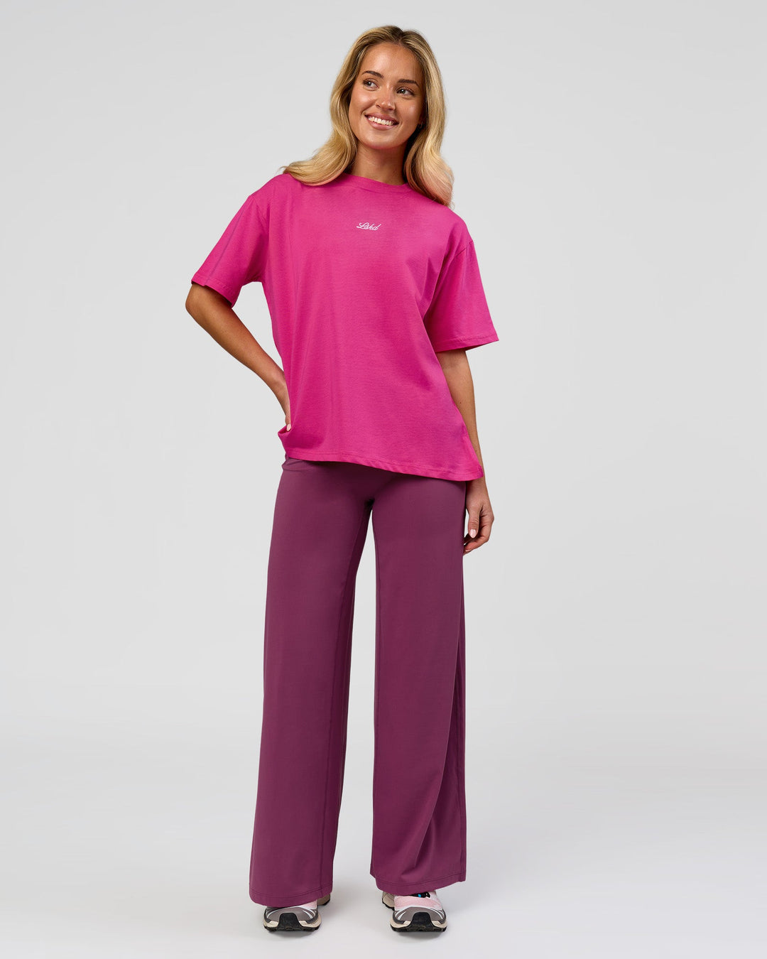 Woman wearing Go-To Script FLXCotton Oversized Tee - Ultra Pink-White | Model:Issy | Size:XS - view 3