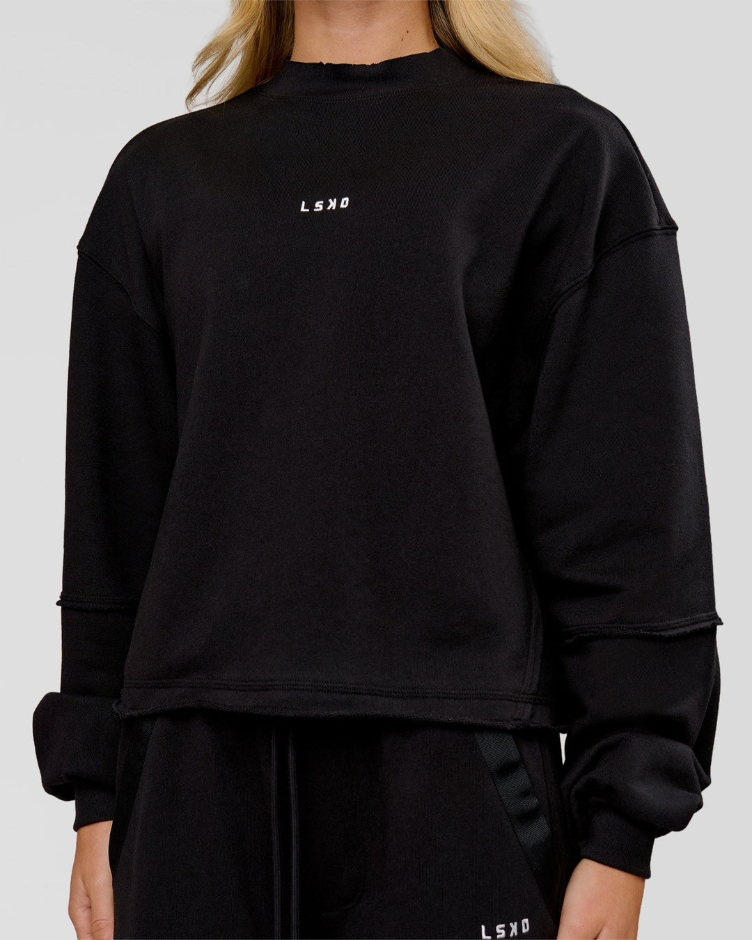 Woman wearing Go-To Terry Oversized Pull Over - Black-White | Model:Issy | Size:XS - view 2