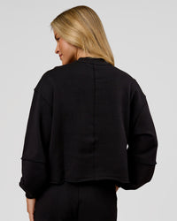 Woman wearing Go-To Terry Oversized Pull Over - Black-White | Model:Issy | Size:XS | Thumbnail Index: 3