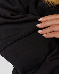 Woman wearing Go-To Terry Oversized Pull Over - Black-White | Model:Issy | Size:XS | Thumbnail Index: 6