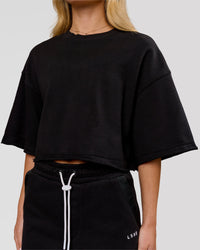 Woman wearing Go-To Terry Oversized Tee - Black | Model:Issy | Size:XS | Thumbnail Index: 1
