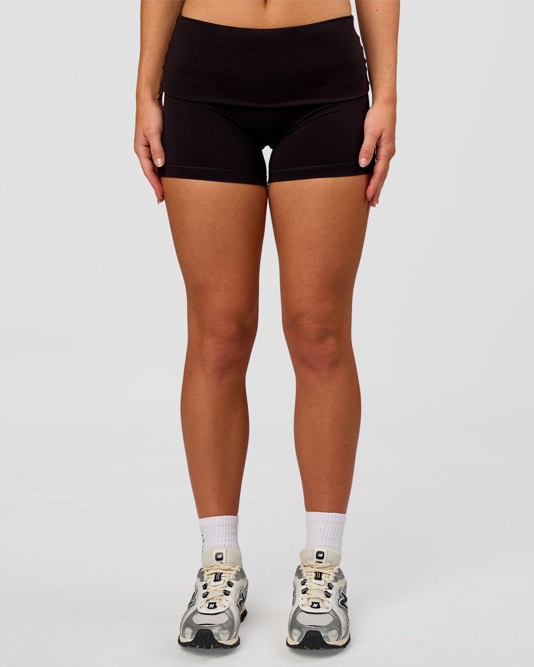 Woman wearing Groovy High Rise Fold Over 4" Short - Black | Model:Issy | Size:XS