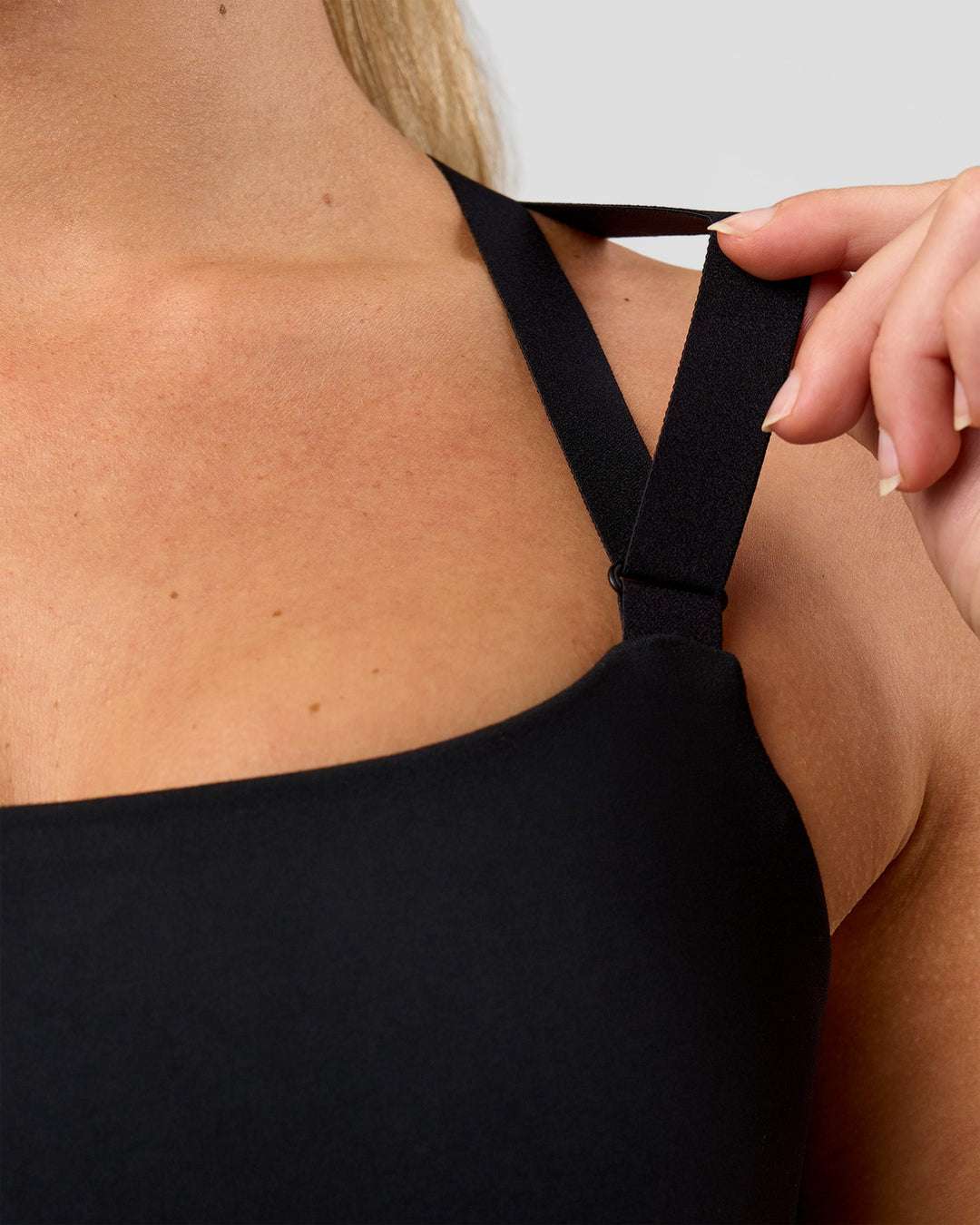 Woman wearing High Velocity Sports Bra - Black | Model:Issy | Size:XS - view 6