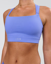 Woman wearing High Velocity Sports Bra - Bluebell | Model:Issy | Size:XS | Thumbnail Index: 2