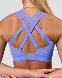 Woman wearing High Velocity Sports Bra - Bluebell | Model:Issy | Size:XS | Thumbnail Index: 1