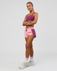 Woman wearing High Velocity Sports Bra - Boysenberry | Model:Issy | Size:XS | Thumbnail Index: 3