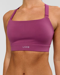 Woman wearing High Velocity Sports Bra - Boysenberry | Model:Issy | Size:XS | Thumbnail Index: 4