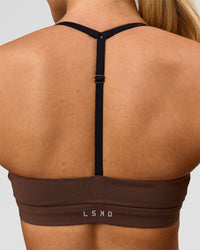 Woman wearing Infinity Sports Bra - Hot Chocolate | Model:Issy | Size:XS | Thumbnail Index: 1