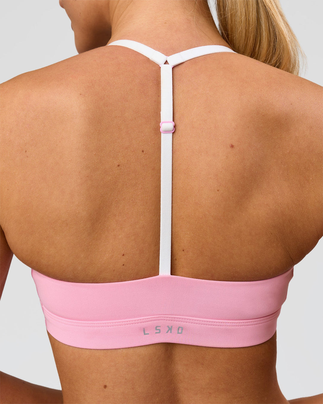 Woman wearing Infinity Sports Bra - Pink Rose | Model:Issy | Size:XS - view 3