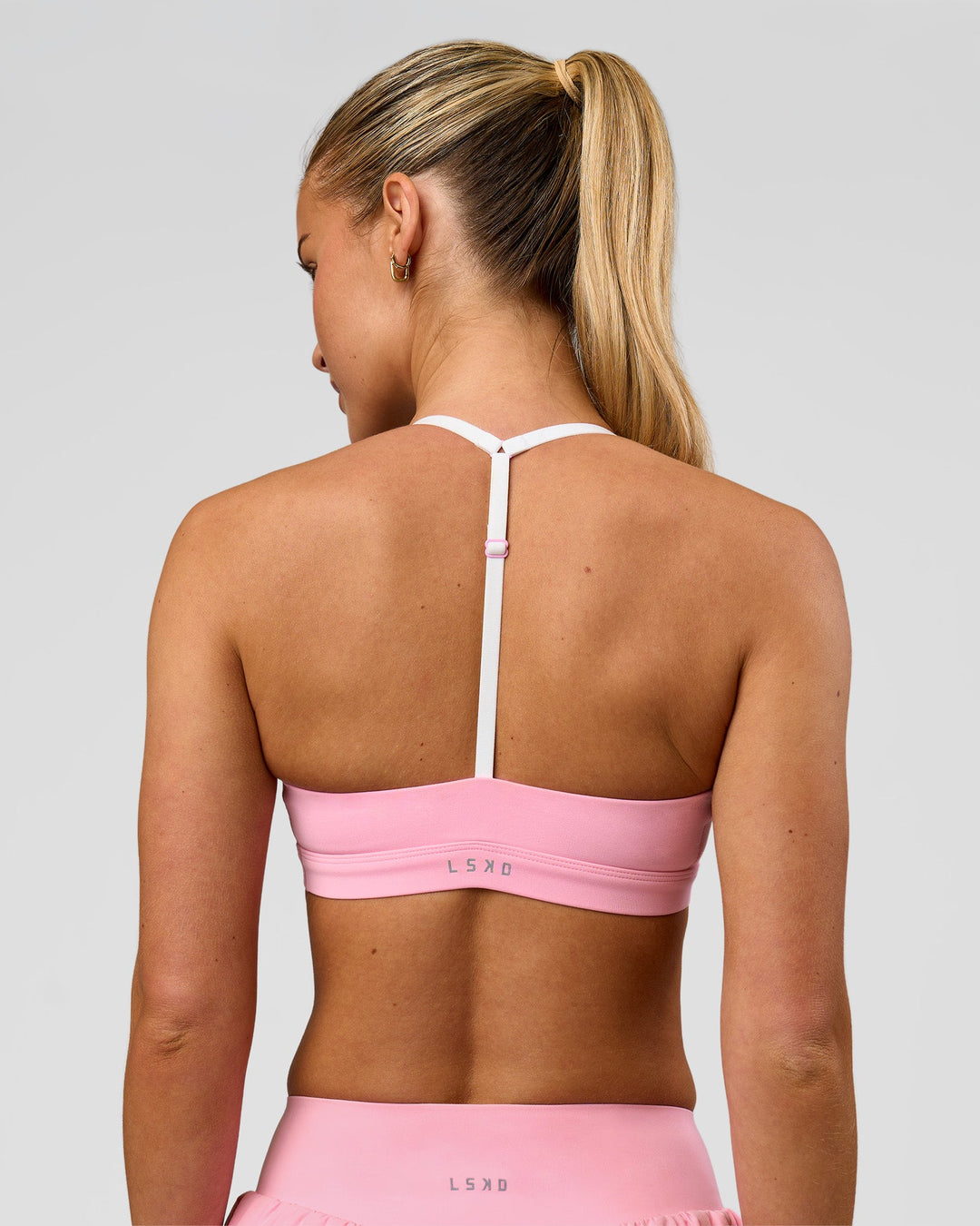 Woman wearing Infinity Sports Bra - Pink Rose | Model:Issy | Size:XS - view 2