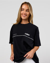 Woman wearing Inline Heavyweight FLXCotton Oversized Tee - Black-White | Model:Issy | Size:XS | Thumbnail Index: 5