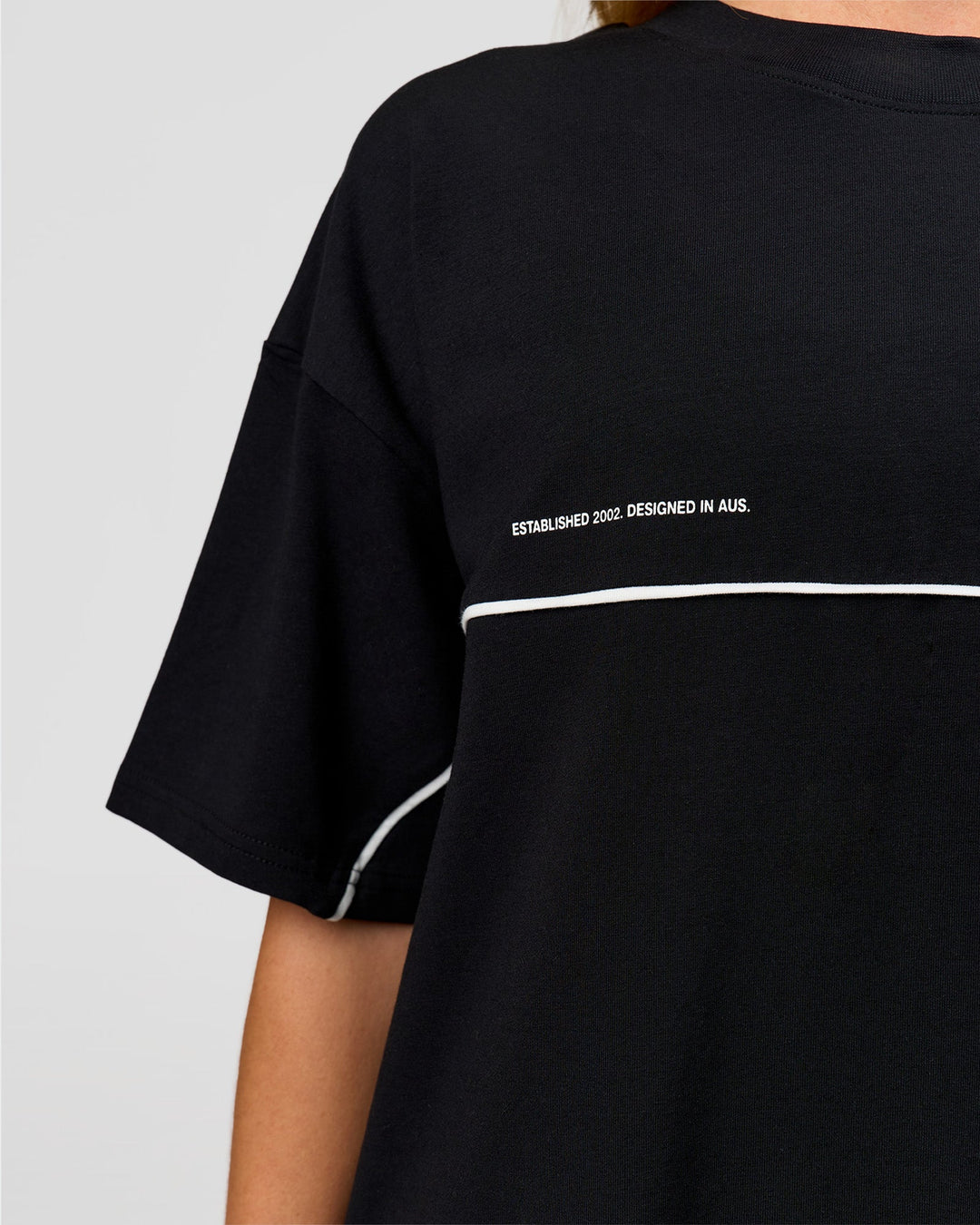 Woman wearing Inline Heavyweight FLXCotton Oversized Tee - Black-White | Model:Issy | Size:XS - view 15