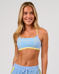 Woman wearing Liberate Sports Bra - Open Air-Lemon | Model:Issy | Size:XS | Thumbnail Index: 3