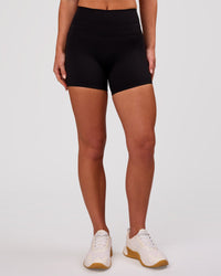 Woman wearing Luxe V-Contour High-Rise 4" Short - Black | Model:Issy | Size:XS | Thumbnail Index: 3