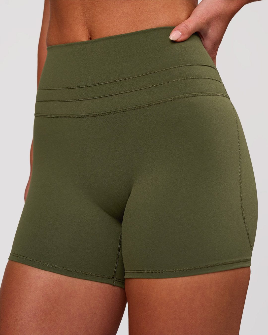 Woman wearing Luxe V-Contour High-Rise 4" Short - Pure Olive | Model:Issy | Size:XS - view 2