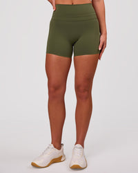 Woman wearing Luxe V-Contour High-Rise 4" Short - Pure Olive | Model:Issy | Size:XS | Thumbnail Index: 2