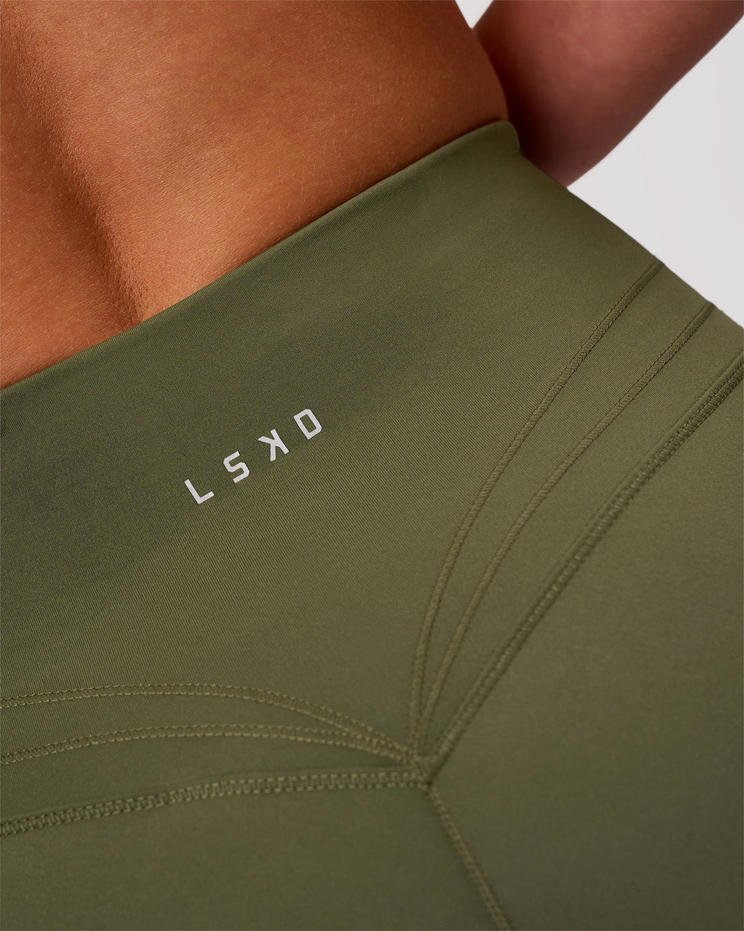 Woman wearing Luxe V-Contour High-Rise 4" Short - Pure Olive | Model:Issy | Size:XS - view 5