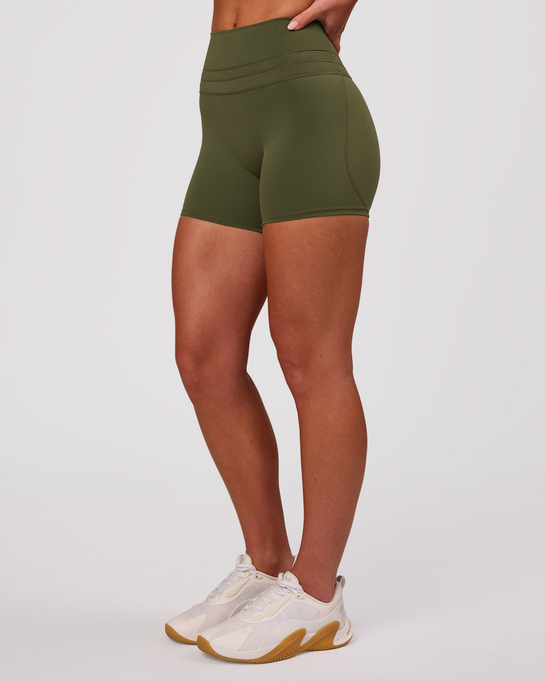 Woman wearing Luxe V-Contour High-Rise 4" Short - Pure Olive | Model:Issy | Size:XS - view 6