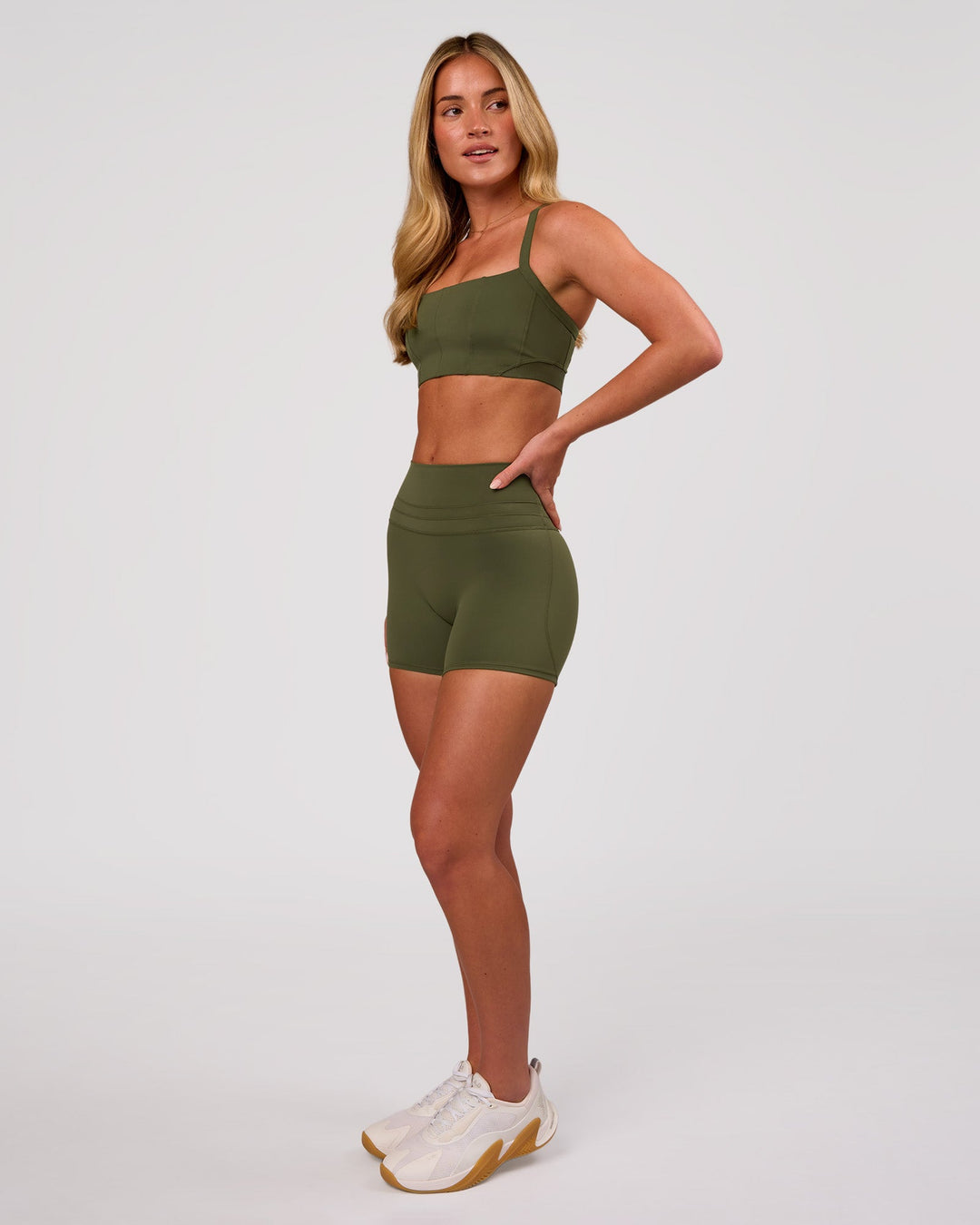 Woman wearing Luxe V-Contour High-Rise 4" Short - Pure Olive | Model:Issy | Size:XS - view 7