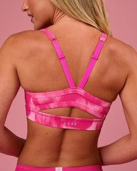 Woman wearing Momentum Sports Bra - Radiant Pink | Model:Issy | Size:XS | Thumbnail Index: 1