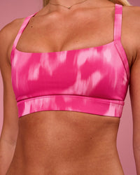 Woman wearing Momentum Sports Bra - Radiant Pink | Model:Issy | Size:XS | Thumbnail Index: 2