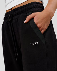 Woman wearing MVP Elite Terry Wide Leg Pant - Black-White | Model:Issy | Size:XS | Thumbnail Index: 2